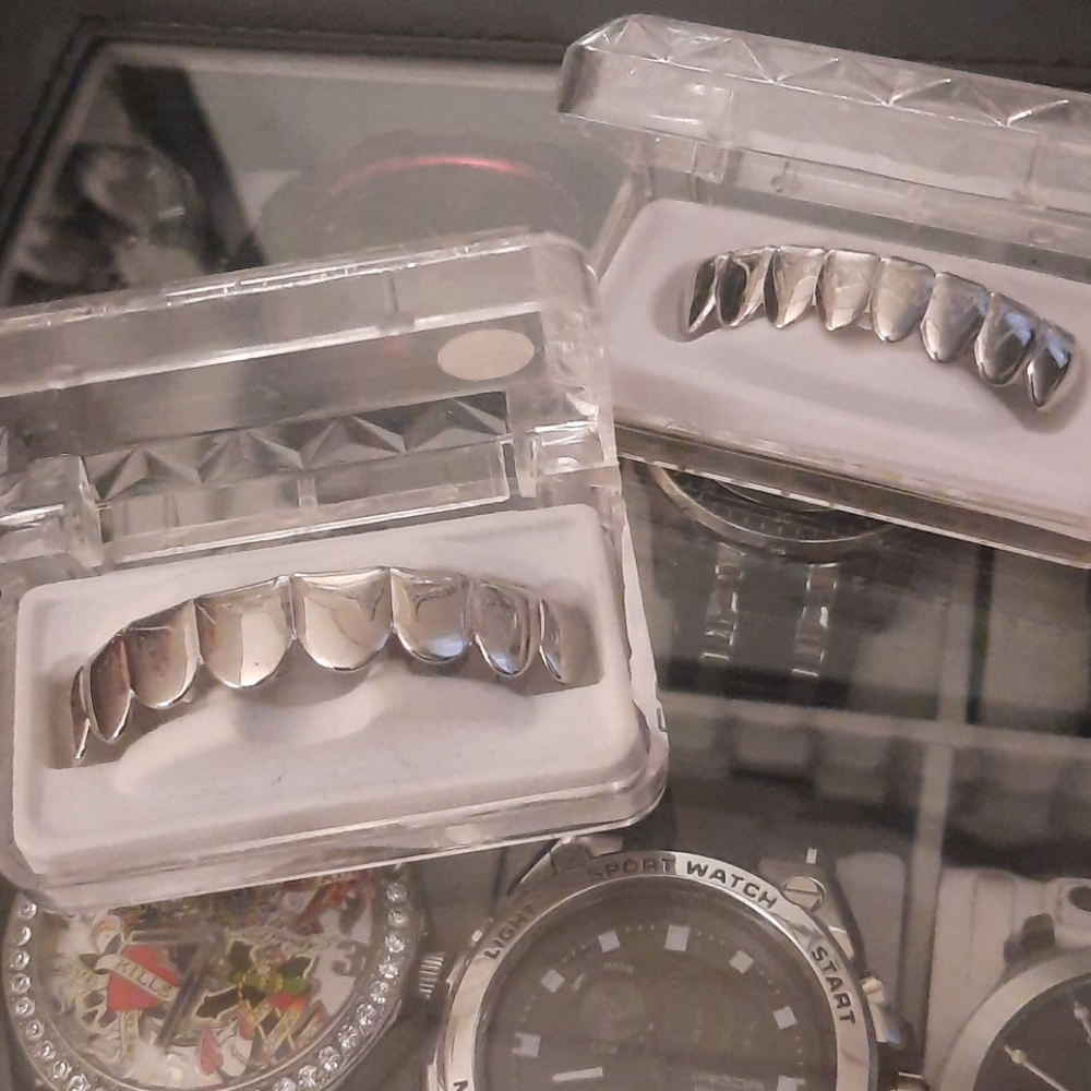 Adult.. upper and bottom "grills"... silver..